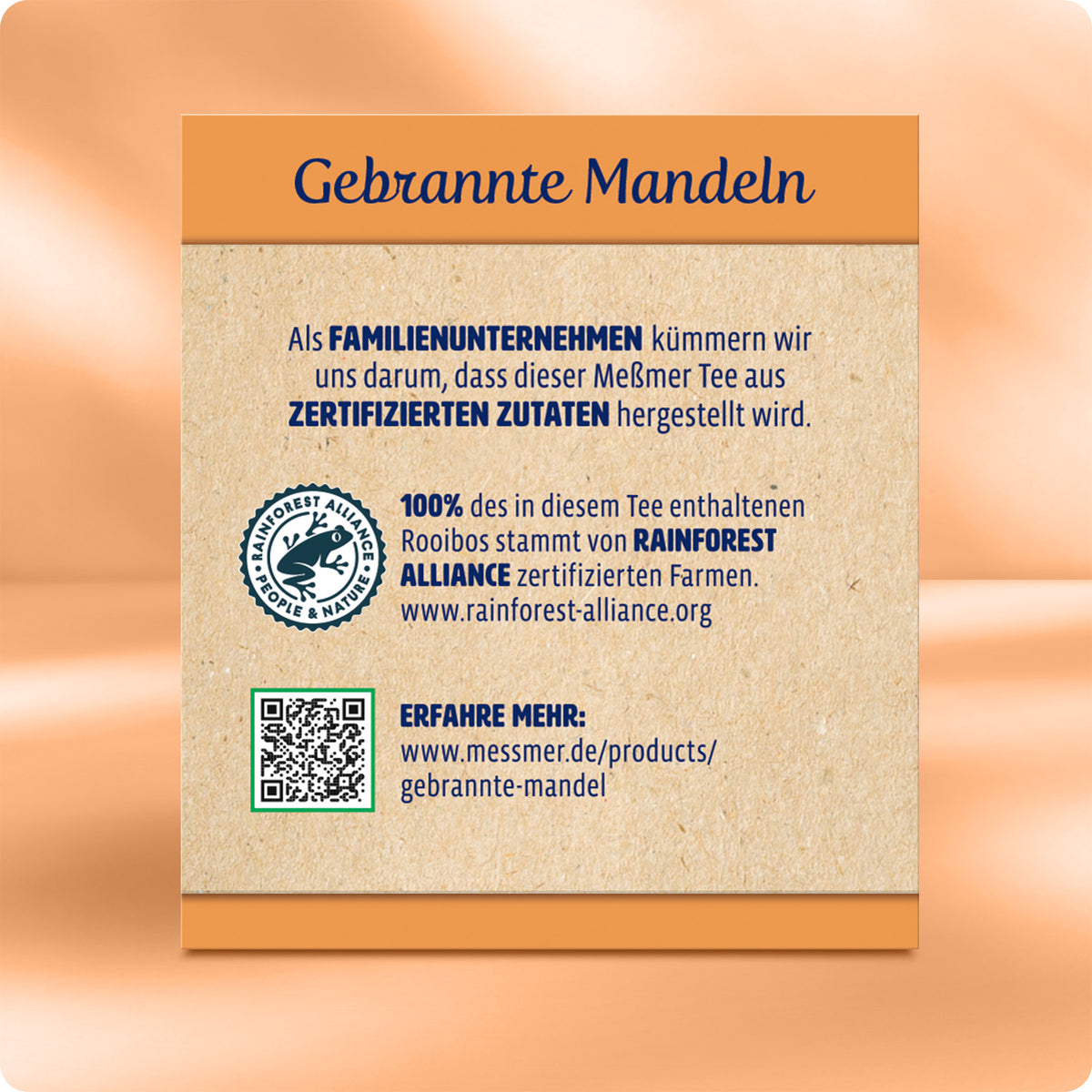 Rückseite der Gebrannte Mandel Verpackung mit Angaben zu zertifizierten Zutaten, Rainforest Alliance Siegel, familiengeführtem Unternehmen und QR-Code für weitere Infos.