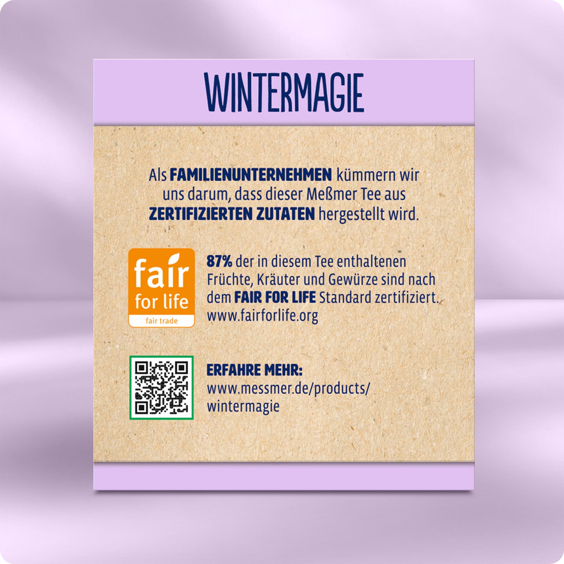 Rückseite der Wintermagie Verpackung mit Infos zu fair gehandelten, zertifizierten Zutaten, Fair-for-Life-Siegel und QR-Code für weitere Details zum Meßmer Tee.