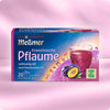 Verpackung von Französische Pflaume Früchtetee mit Pflaumen-Aroma, dampfender Teetasse und Pflaumenfrüchten vor lila Hintergrund, Hinweis auf vollmundig-süßen Geschmack und Nachhaltigkeit.