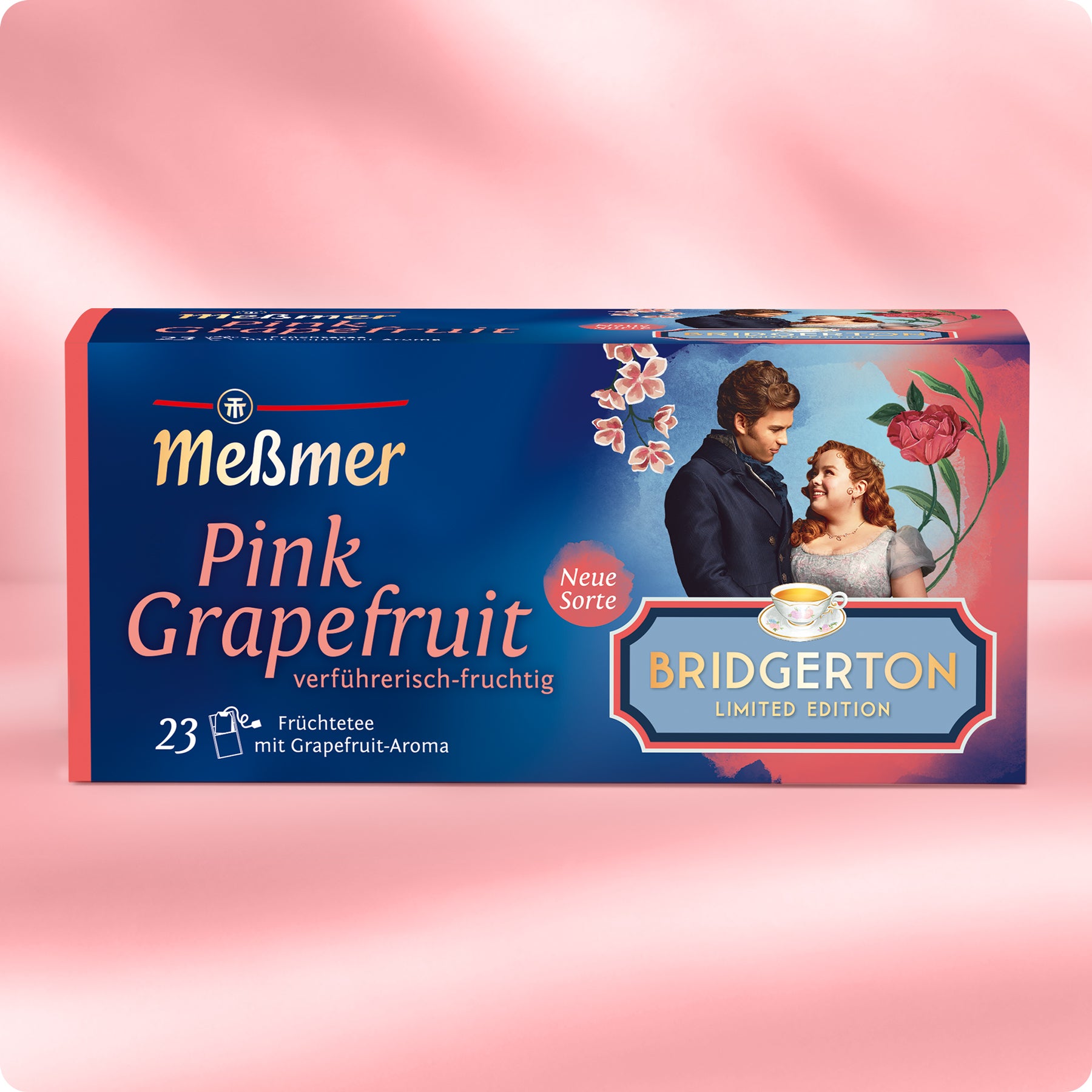 Verpackung von Meßmer Pink Grapefruit Tee mit Illustration eines Paares und Blumen auf rosa Hintergrund.