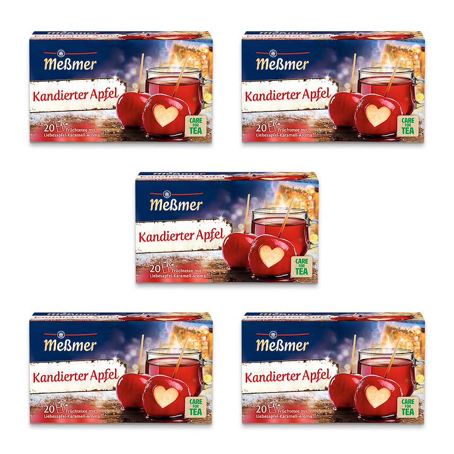 Fünf Packungen Meßmer Kandierter Apfel Früchtetee mit roten Äpfeln und einer Tasse auf weißem Hintergrund